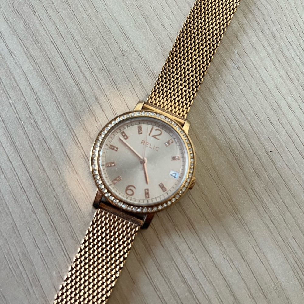 Gold Relic Watch battery operated shows number day/ brand new/ has clear cover